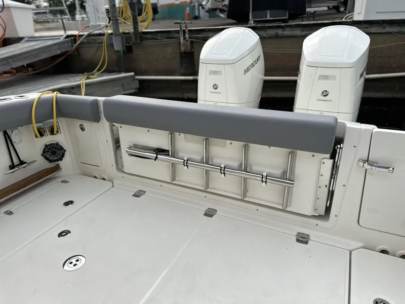 Slide: The Image of 2025 Boston Whaler 380 Realm boat deck with dual Mercury outboard engines. - 7