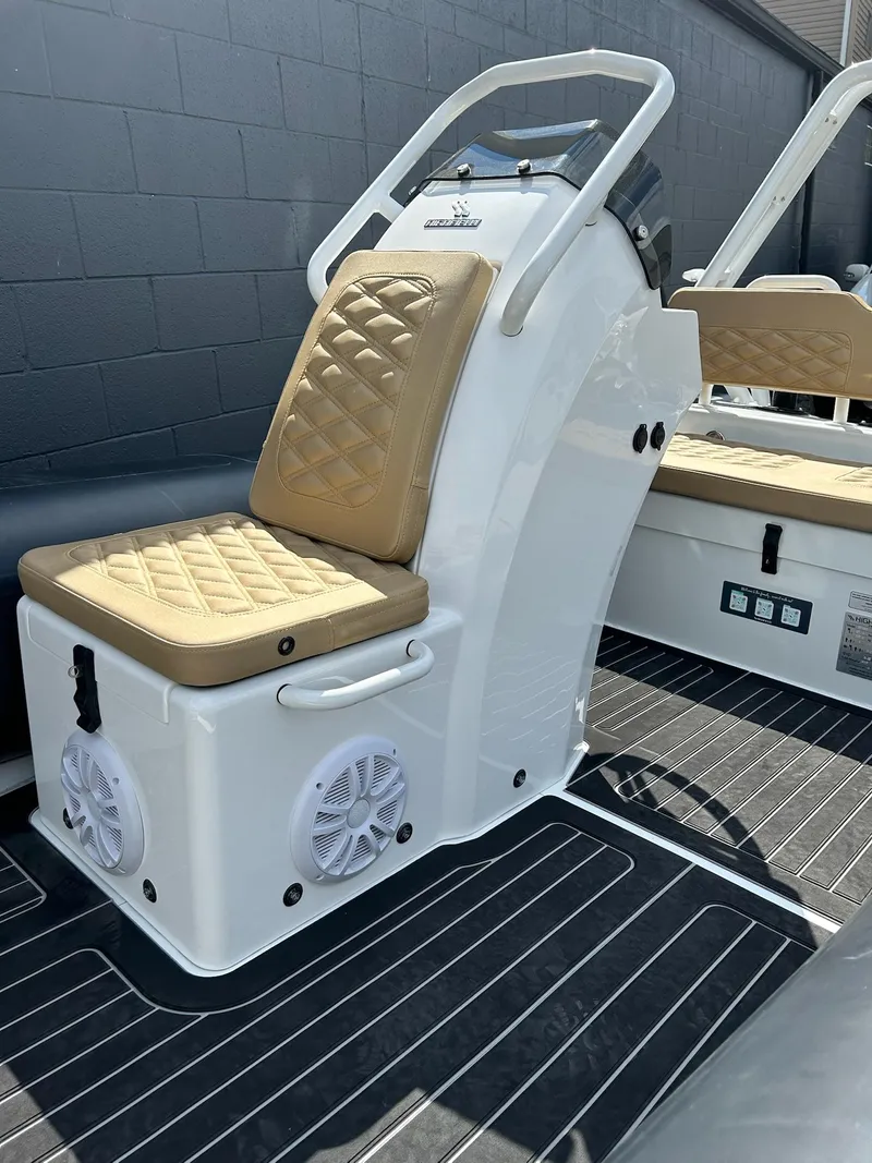 Slide: The Image of 2025 Highfield Sport 460 boat interior with cushioned seating and modern design. - 12
