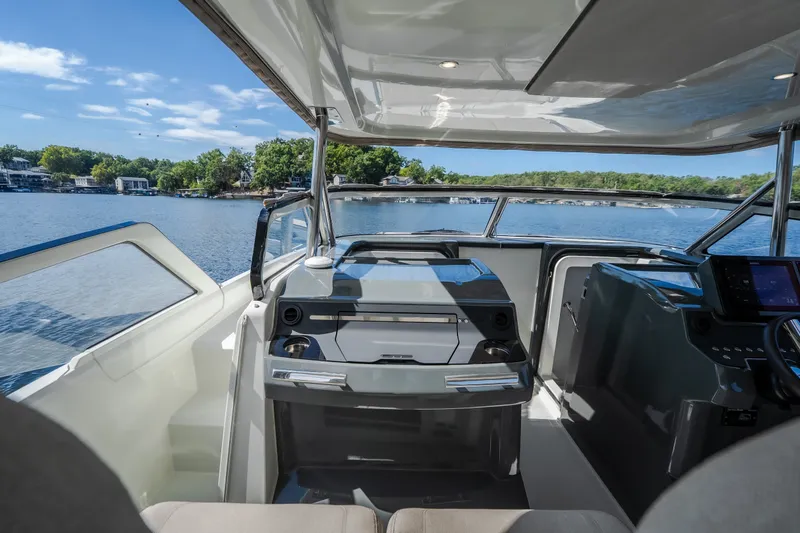 Slide: The Image of Modern Catamaran YOT 36 cockpit with sleek design, overlooking serene lake view. - 54