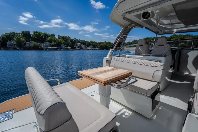 Slide: The Image of Luxurious 2025 Catamaran YOT 36 interior with elegant seating and scenic lake view. - 26