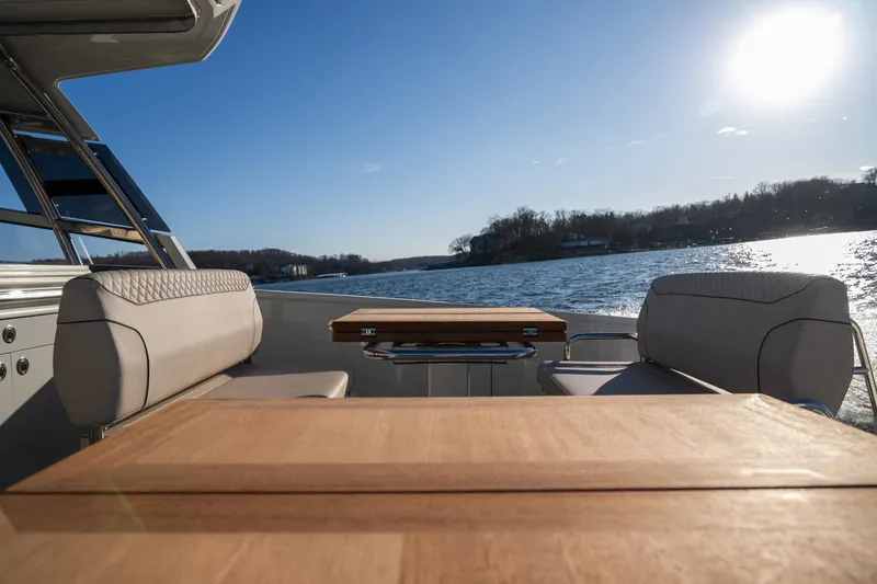 Slide: The Image of Luxurious Catamaran YOT 36, 2025 model, with elegant seating and scenic water view. - 10