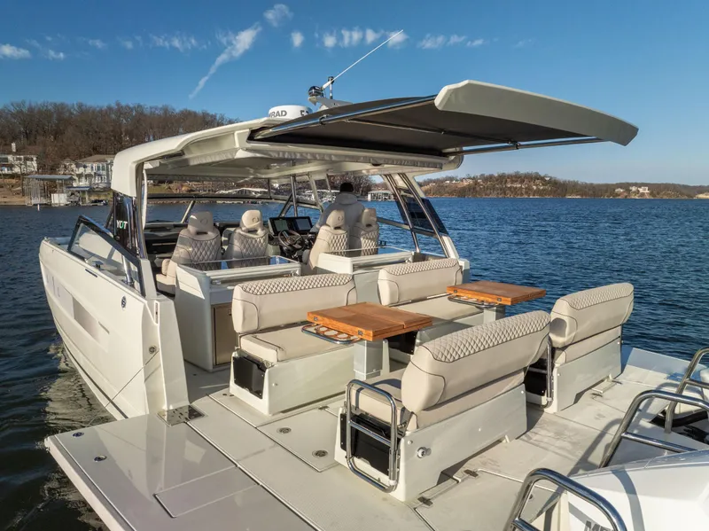 Slide: The Image of Luxurious 2025 Catamaran YOT 36 on serene lake, featuring spacious seating and modern design. - 11