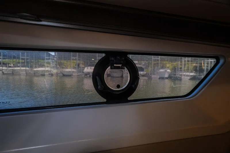 Slide: The Image of Interior view of a 2025 Catamaran YOT 36 window with marina background. - 48