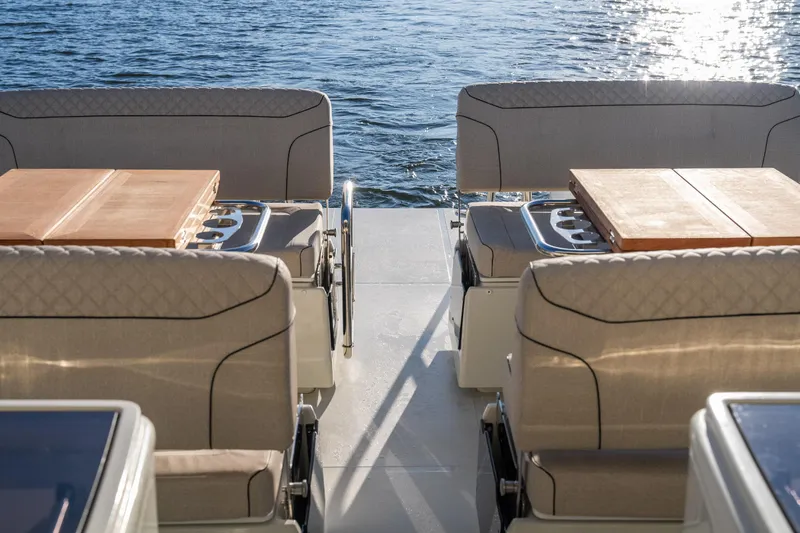 Slide: The Image of Luxury seating on 2025 Catamaran YOT 36, overlooking serene water. - 17