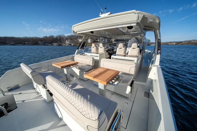 Slide: The Image of Luxurious 2025 Catamaran YOT 36 with elegant seating and tables on open water. - 20