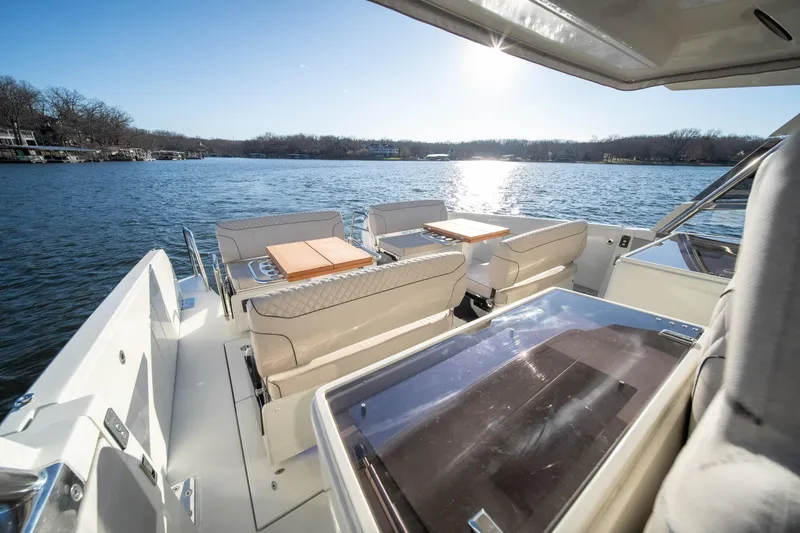 Slide: The Image of Luxurious 2025 Catamaran YOT 36 with spacious seating on a serene lake. - 21