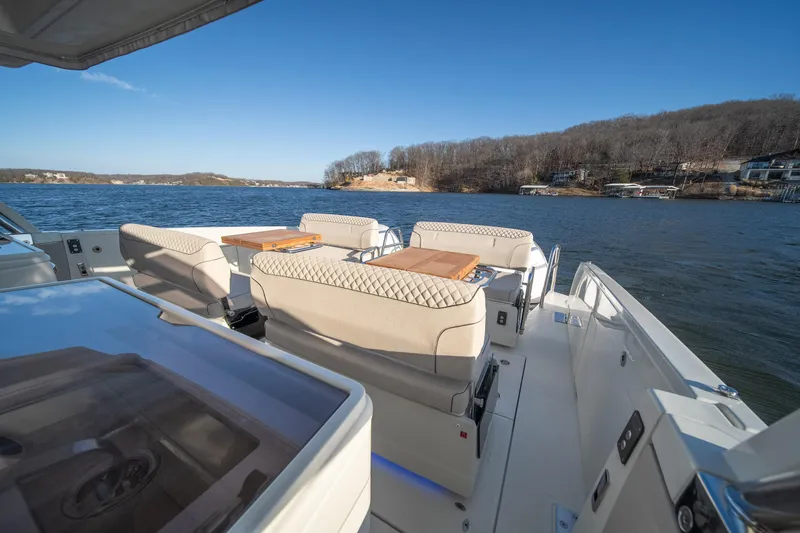 Slide: The Image of Luxurious 2025 Catamaran YOT 36 with elegant seating, cruising on a serene lake. - 23