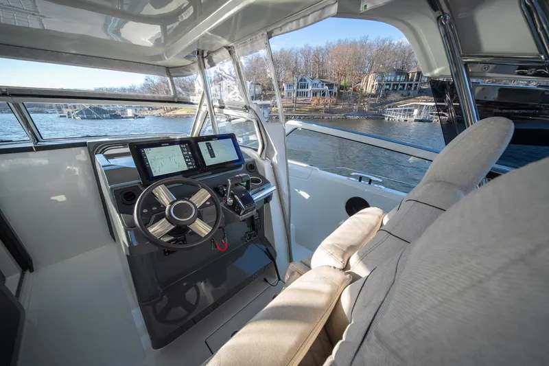 Slide: The Image of 2025 Catamaran YOT 36 cockpit with modern navigation system and waterfront view. - 24