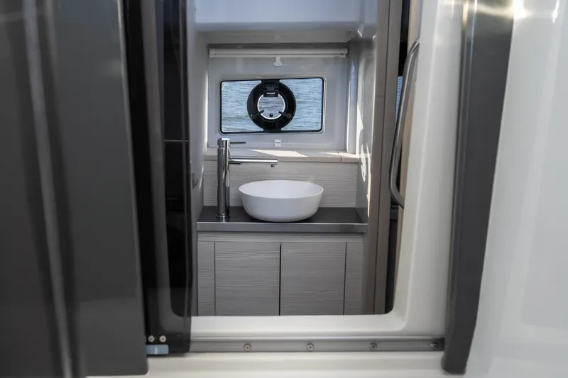Slide: The Image of Modern bathroom interior on 2025 Catamaran YOT 36 with sleek sink and window view. - 26