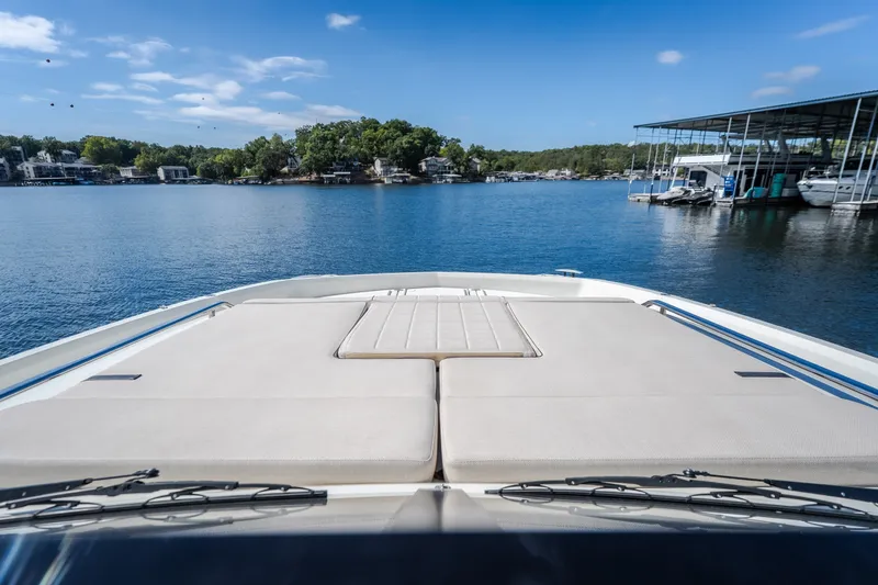 Slide: The Image of Front deck view of 2025 Catamaran YOT 36 on a serene lake. - 51