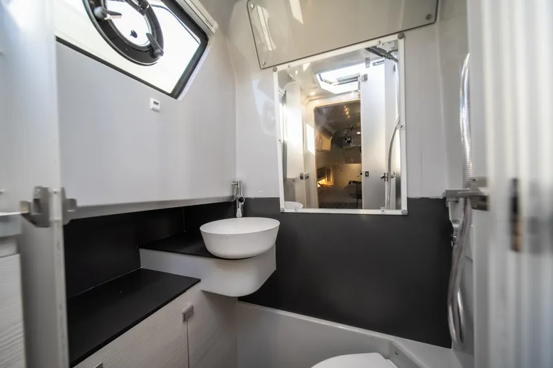 Slide: The Image of Modern bathroom interior of 2025 Catamaran YOT 36, featuring sleek design and compact fixtures. - 29