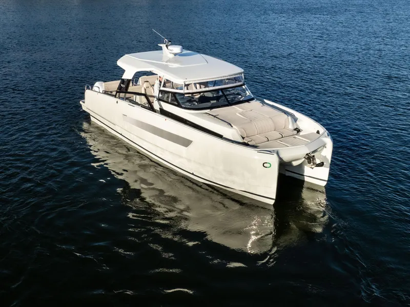 Slide: The Image of 2025 Catamaran YOT 36 cruising on calm blue waters. - 3