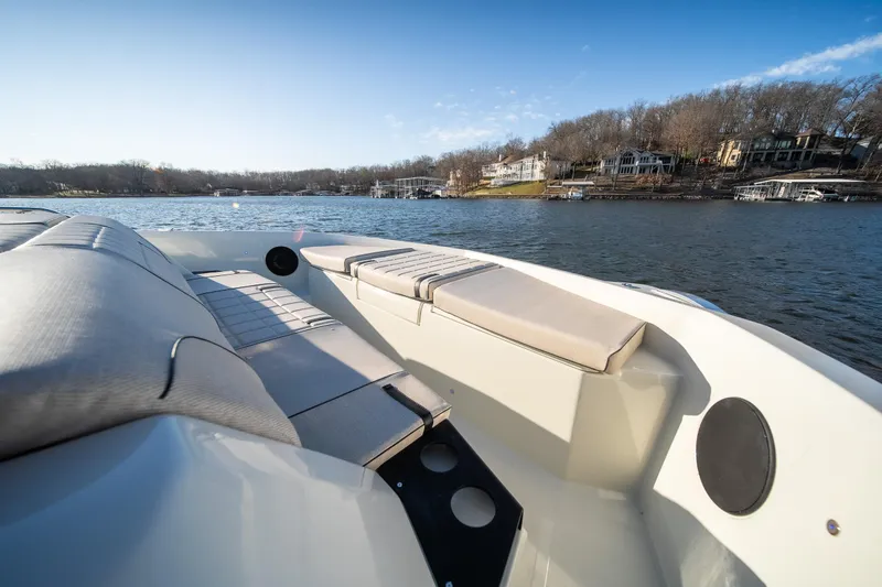 Slide: The Image of 2025 Catamaran YOT 36 on serene lake with comfortable seating and scenic view. - 31