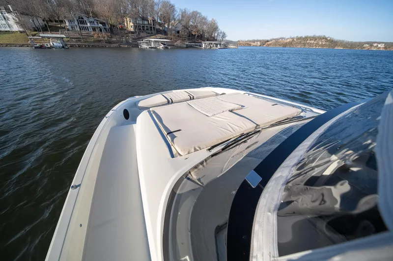 Slide: The Image of 2025 Catamaran YOT 36 on a serene lake with scenic shoreline views. - 32