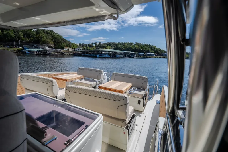 Slide: The Image of Luxurious 2025 Catamaran YOT 36 with elegant seating, docked by serene waters. - 69