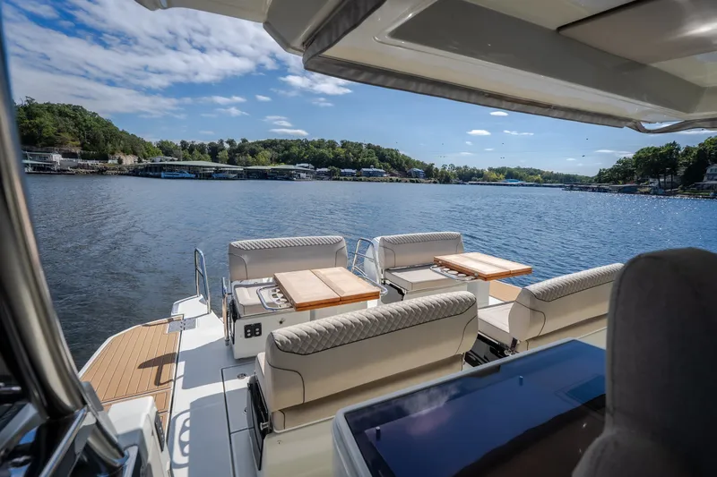 Slide: The Image of Luxurious 2025 Catamaran YOT 36 with elegant seating, overlooking serene lake views. - 30