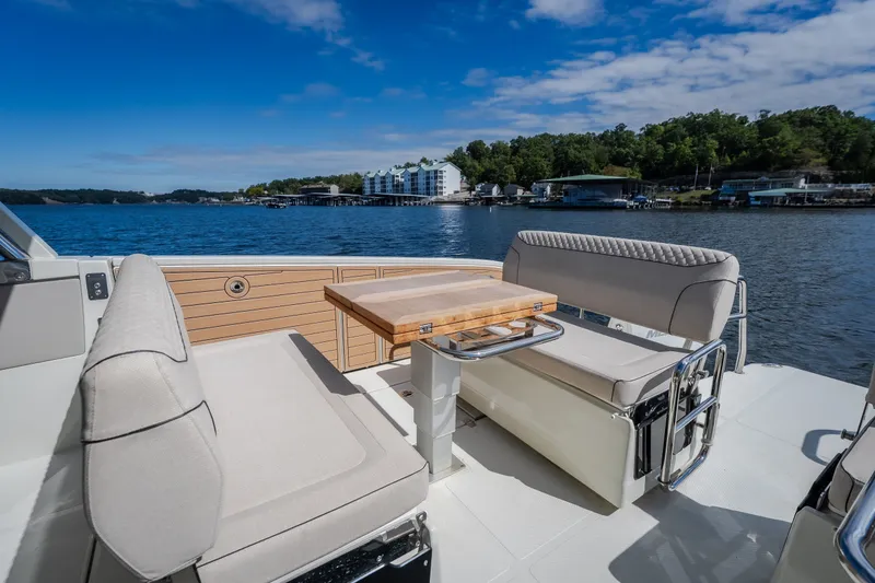Slide: The Image of Luxurious seating area on 2025 Catamaran YOT 36, overlooking serene waters and lush shoreline. - 17