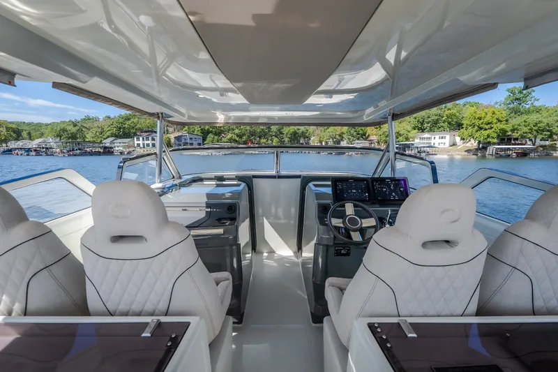 Slide: The Image of Interior view of 2025 Catamaran YOT 36, featuring modern helm and luxurious seating. - 38