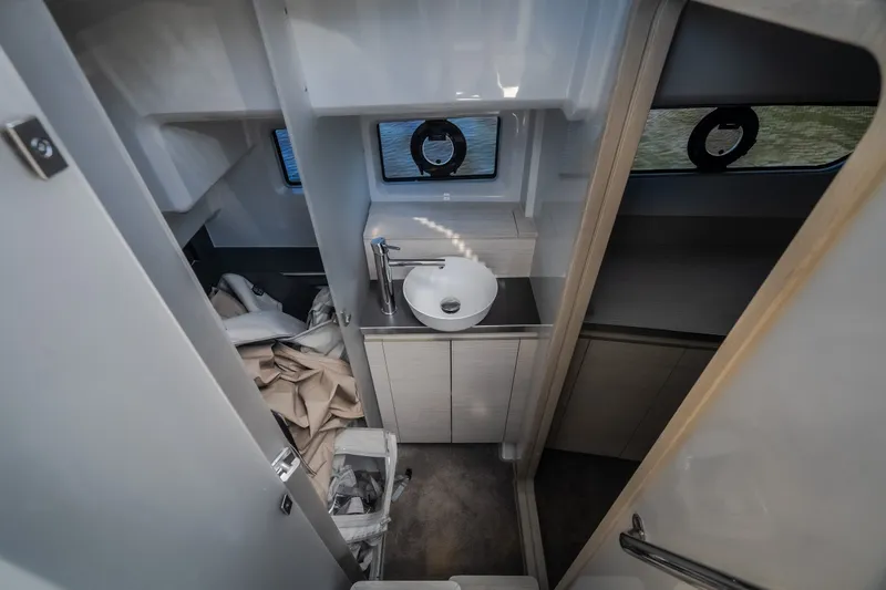 Slide: The Image of Interior of 2025 Catamaran YOT 36, featuring a compact bathroom with modern fixtures. - 45