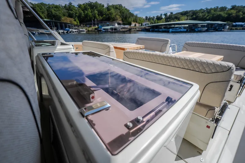 Slide: The Image of Luxurious Catamaran YOT 36 interior with plush seating, overlooking serene waters. - 70