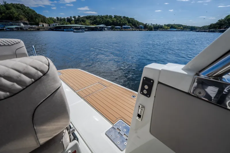 Slide: The Image of Luxury Catamaran YOT 36 deck overlooking serene lake, 2025 model. - 23