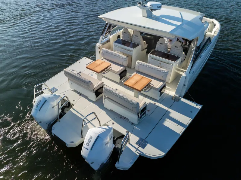 Slide: The Image of 2025 Catamaran YOT 36 with dual engines, spacious seating, and modern design on the water. - 7