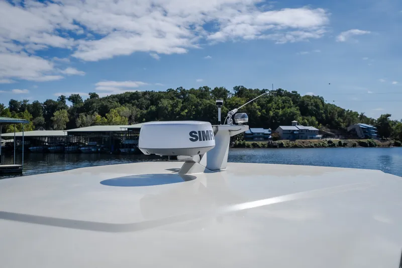Slide: The Image of Rooftop view of 2025 Catamaran YOT 36 with radar, against a scenic waterfront backdrop. - 65