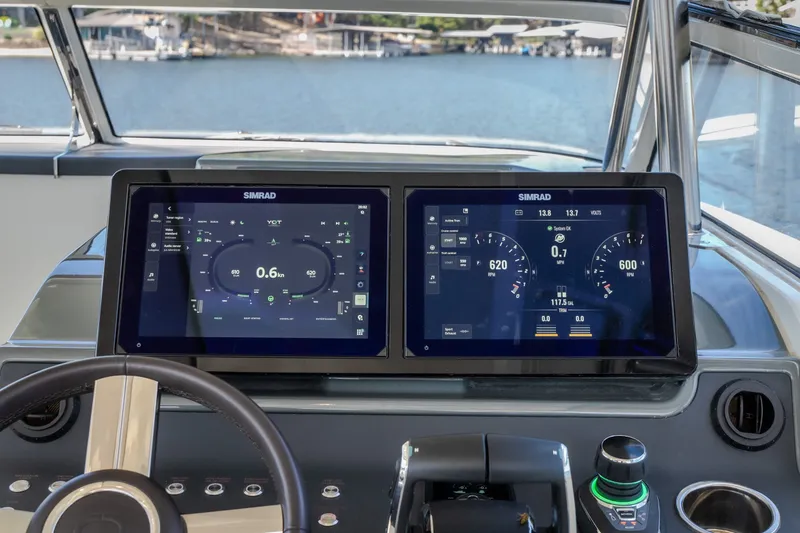 Slide: The Image of Helm of 2025 Catamaran YOT 36 with dual Simrad displays and modern controls. - 34
