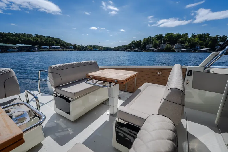 Slide: The Image of Luxurious 2025 Catamaran YOT 36 interior with plush seating and scenic water view. - 16