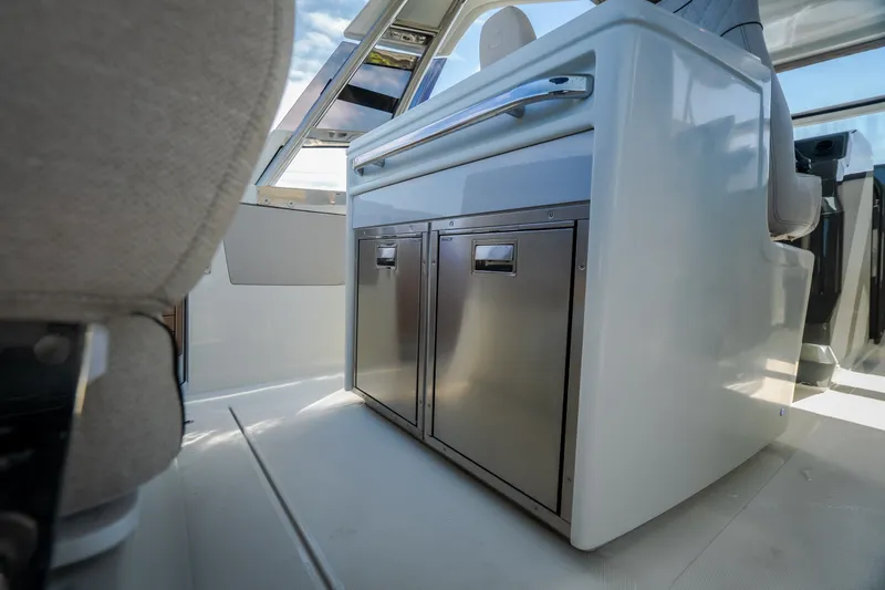 Slide: The Image of Interior of 2025 Catamaran YOT 36, featuring sleek cabinetry and modern design elements. - 40