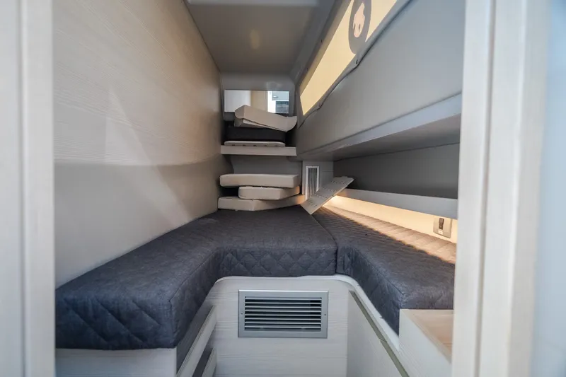 Slide: The Image of Interior cabin of 2025 Catamaran YOT 36, featuring cozy bunk beds and modern design. - 44