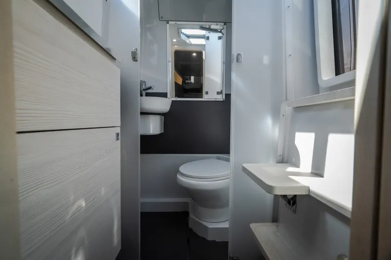 Slide: The Image of Modern bathroom interior of 2025 Catamaran YOT 36, featuring sleek design and compact fixtures. - 43