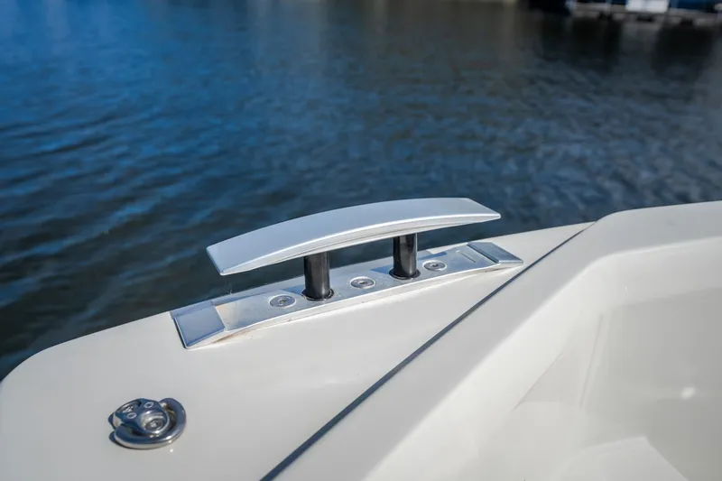Slide: The Image of Close-up of a 2025 Catamaran YOT 36 cleat on calm water. - 60