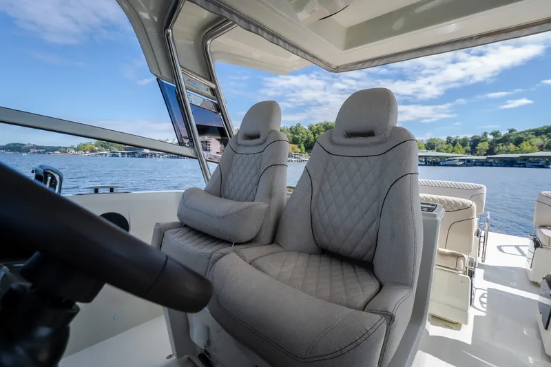 Slide: The Image of Luxurious interior of 2025 Catamaran YOT 36 with plush seating and scenic water view. - 39