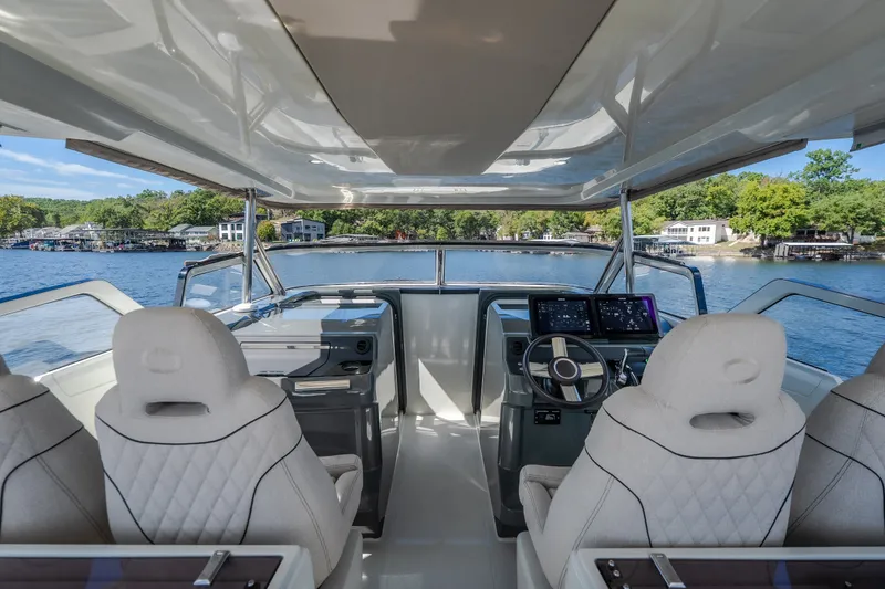 Slide: The Image of Interior view of 2025 Catamaran YOT 36, featuring modern helm and luxurious seating. - 37
