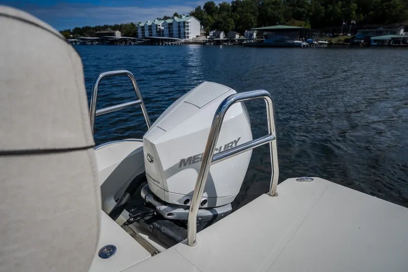 Slide: The Image of 2025 Catamaran YOT 36 with Mercury engine on a serene lake backdrop. - 21