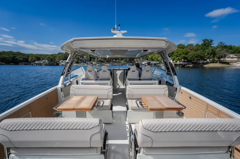 Slide: The Image of Luxurious 2025 Catamaran YOT 36 interior with elegant seating and scenic lake view. - 22