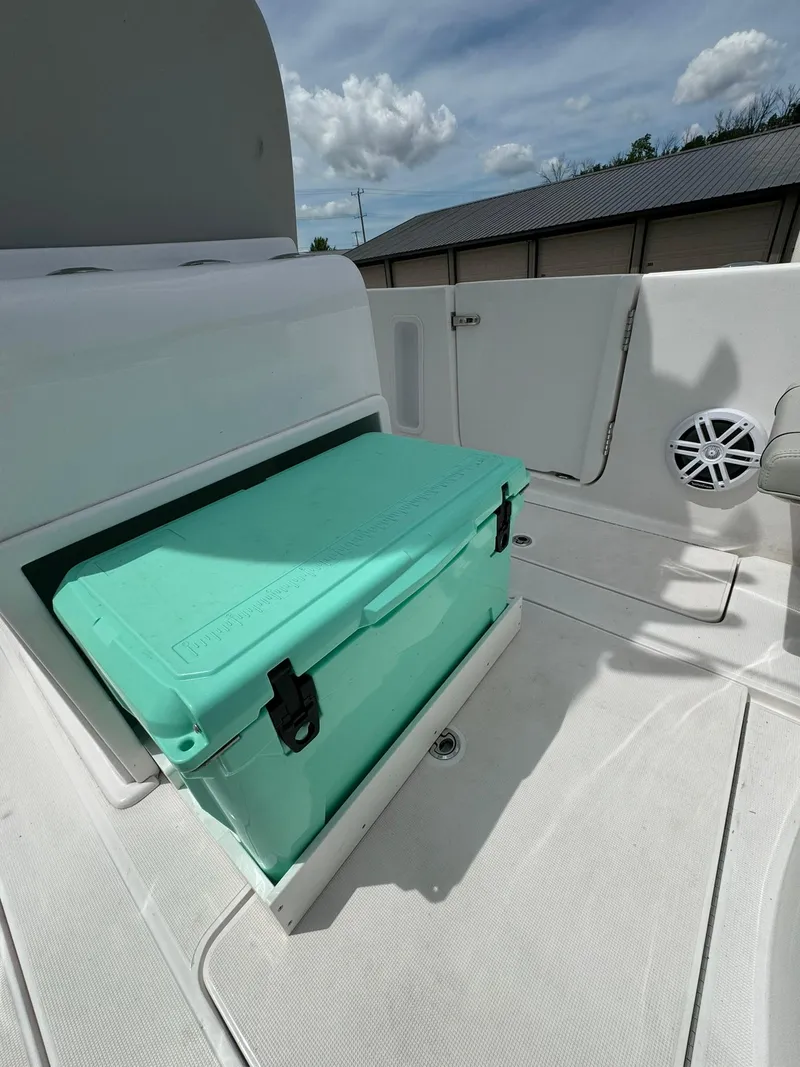 Slide: The Image of 2022 Streamline Center Console boat with teal cooler on deck. - 11