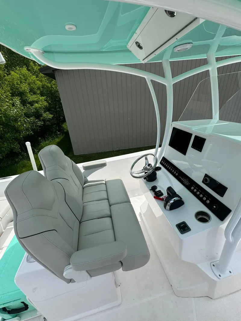 Slide: The Image of 2022 Streamline Center Console boat interior with modern helm and seating. - 13