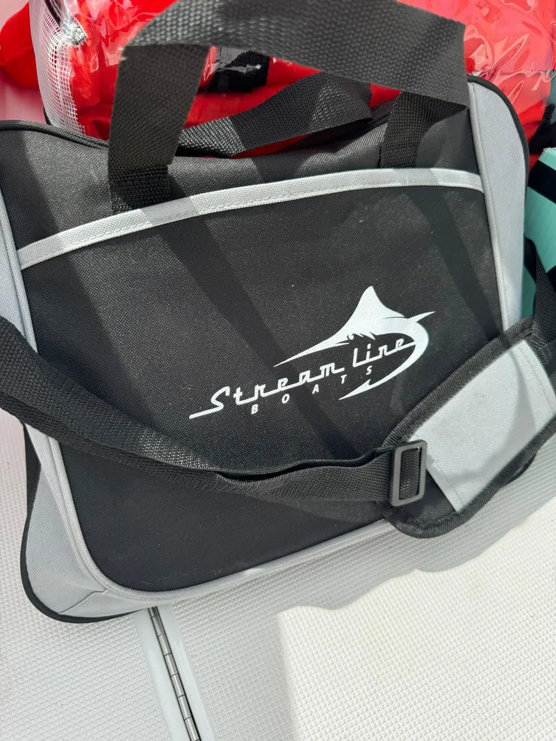Slide: The Image of Streamline Boats bag on a 2022 Center Console, featuring black and gray design. - 21