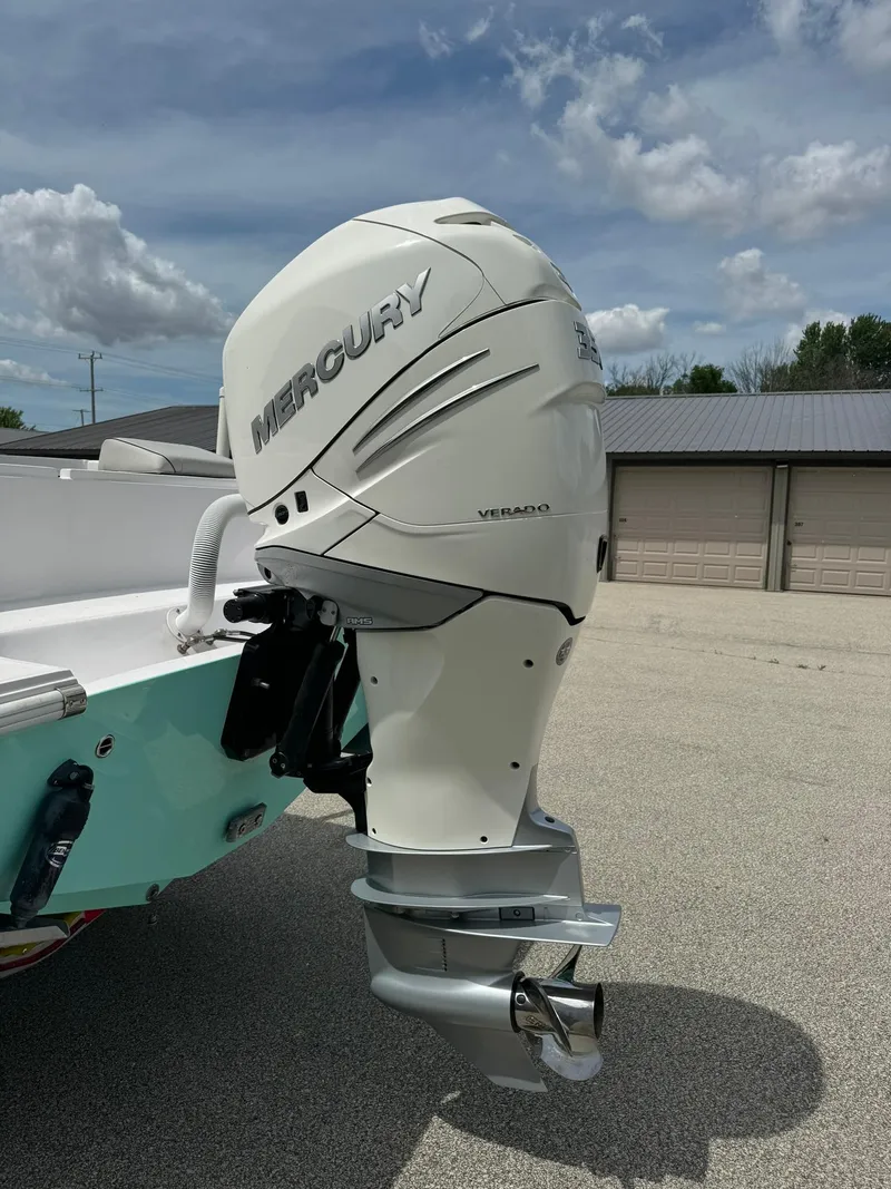 Slide: The Image of 2022 Streamline Center Console with Mercury outboard motor in a sunny outdoor setting. - 3