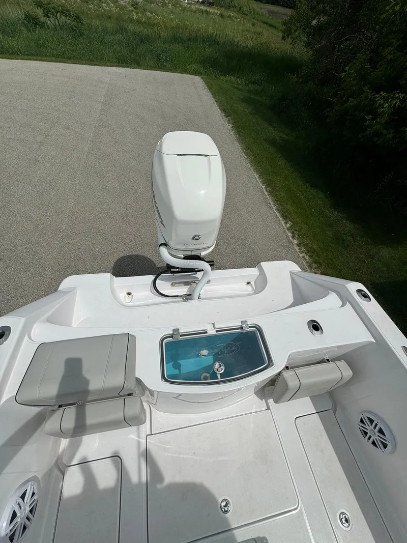 Slide: The Image of 2022 Streamline Center Console boat with outboard motor and seating area. - 7