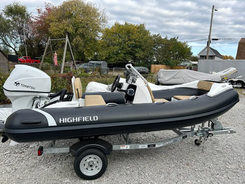 Slide: The Image of 2024 Highfield Sport 390 inflatable boat on trailer with Tohatsu engine. - 1