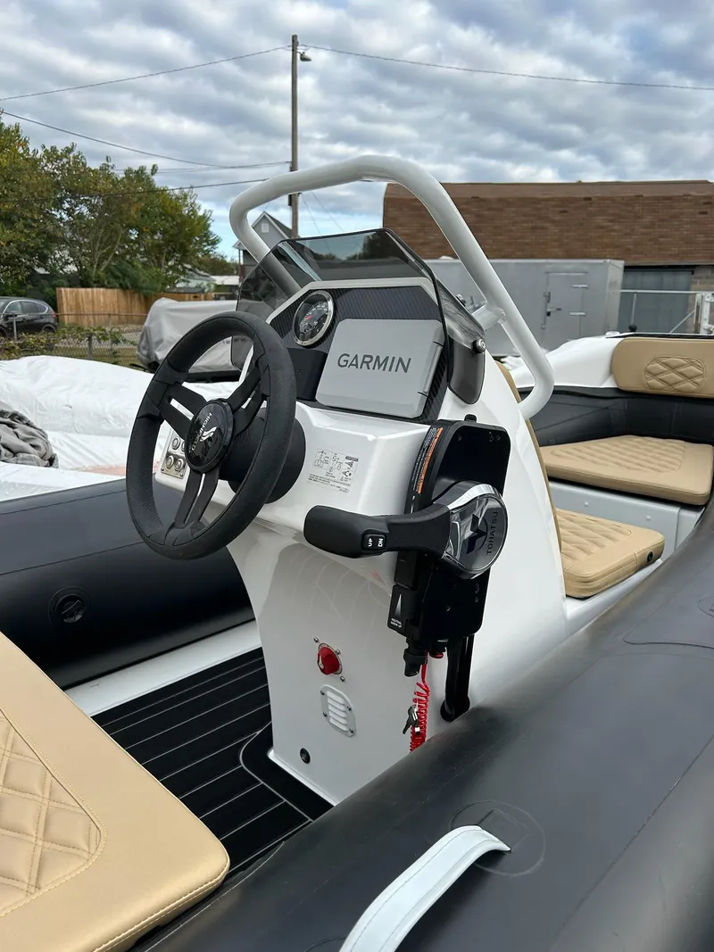 Slide: The Image of 2024 Highfield Sport 390 boat interior with Garmin navigation system. - 3