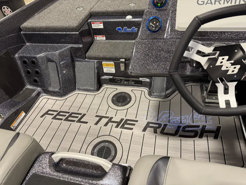 Slide: The Image of 2025 Bass Cat Cougar FTD boat interior with "Feel the Rush" flooring design. - 18