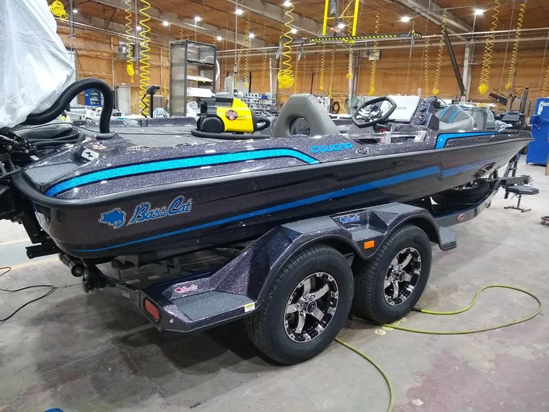 Slide: The Image of 2025 Bass Cat Cougar FTD boat in a workshop setting. - 19