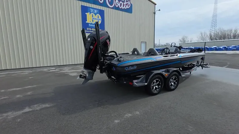 Slide: The Image of 2025 Bass Cat Cougar FTD boat on trailer outside dealership. - 8