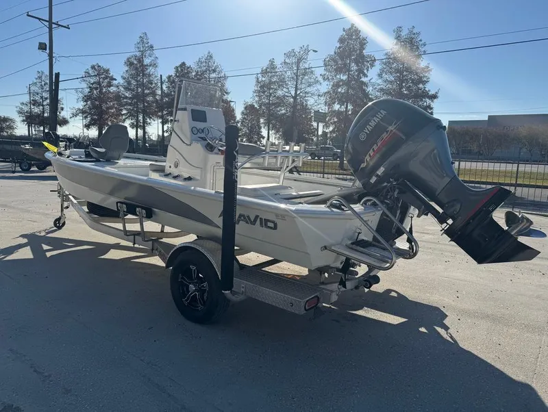 Slide: The Image of 2021 Avid 21 FS boat with Yamaha outboard motor on a trailer. - 5