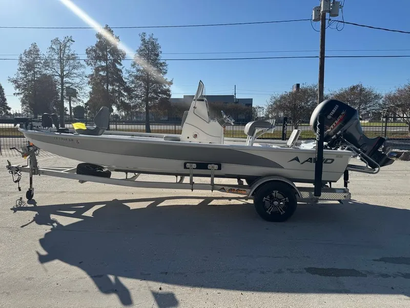 Slide: The Image of 2021 Avid 21 FS boat on trailer, parked outdoors in sunny weather. - 6