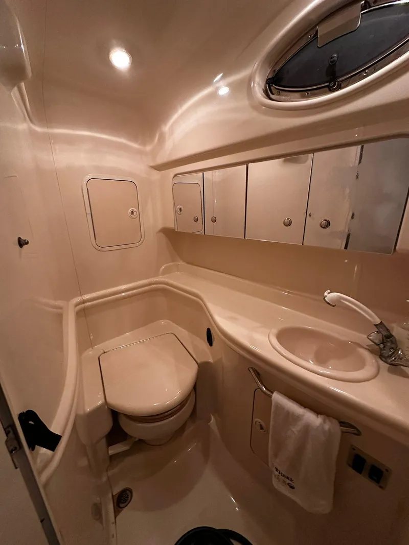 Slide: The Image of Luxurious bathroom in 2002 Sea Ray 320 Sundancer yacht with modern fixtures. - 10